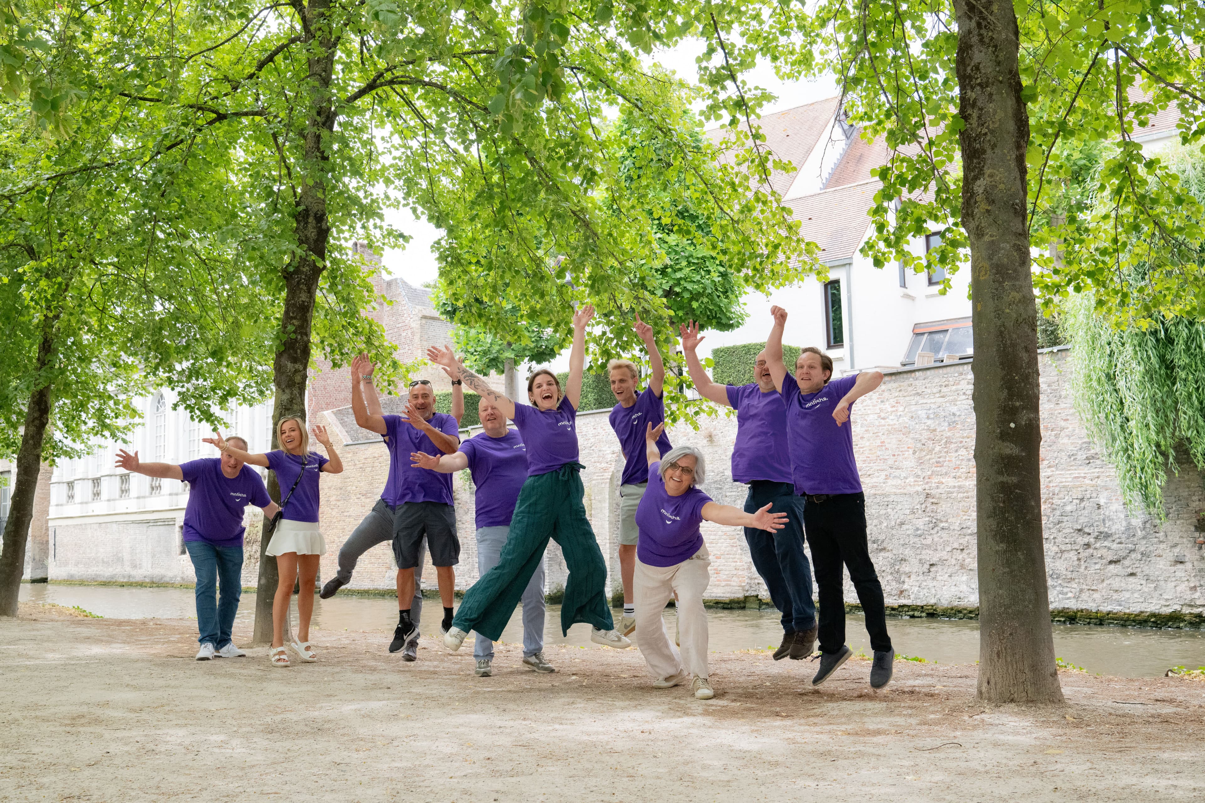 The Motisha team jumping together in Bruges